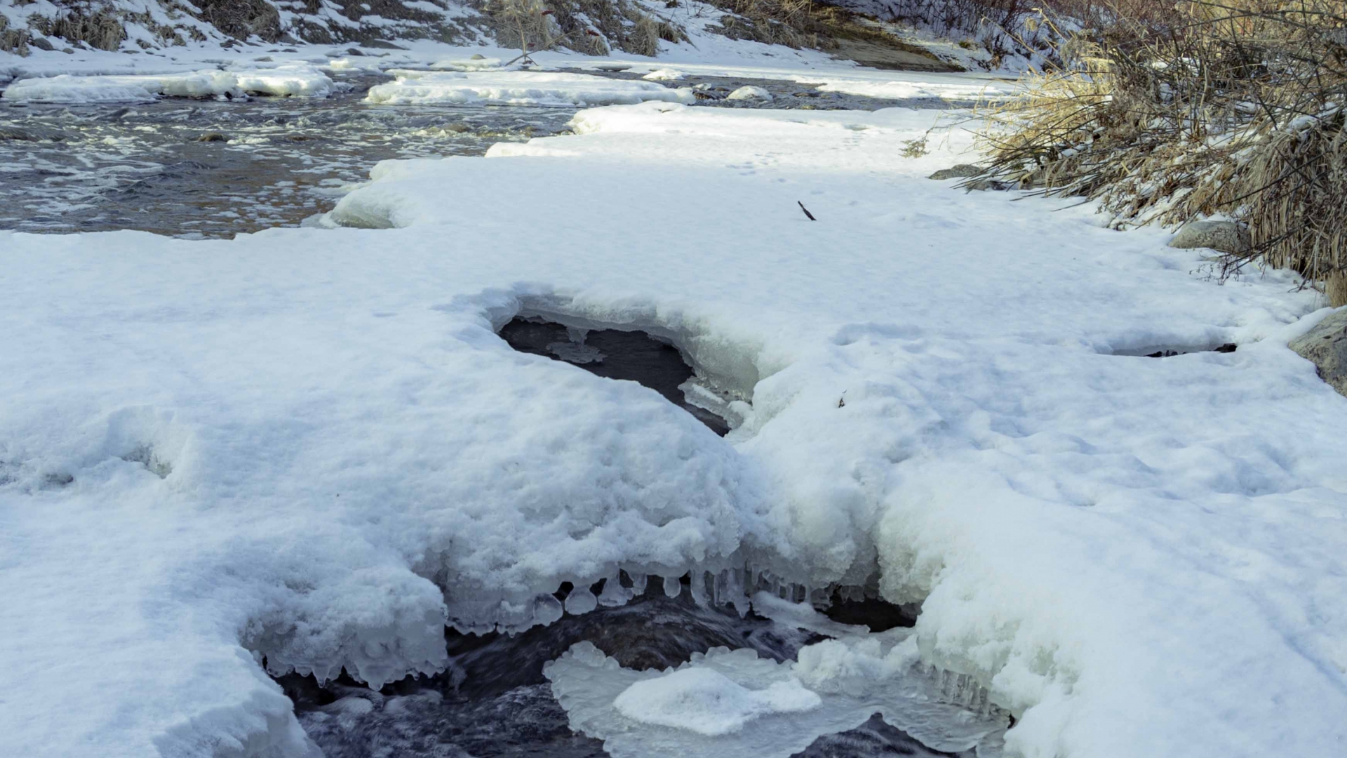 Semi frozen stream of water